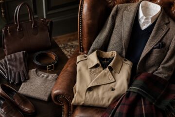 Giacca in tweed, trench, sciarpa tartan e accessori eleganti in stile british